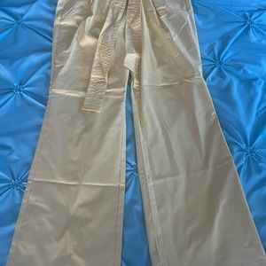 Mid Rise tie straight yellow pants. From NYC